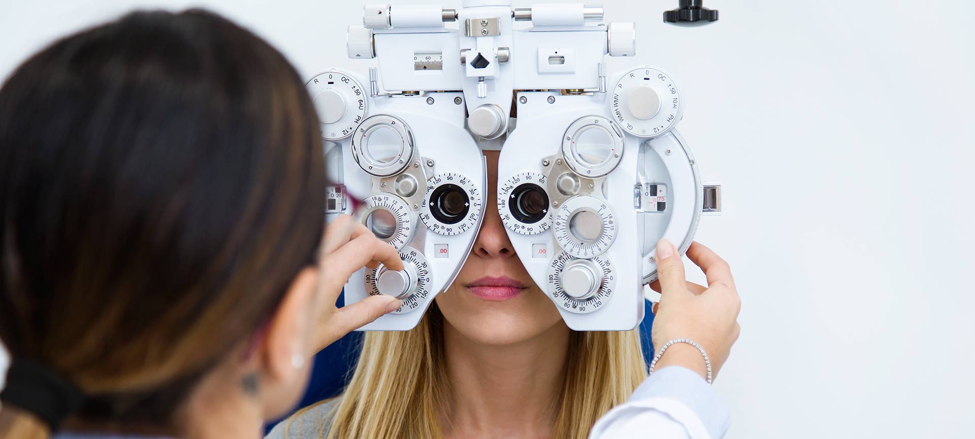 Doctor and patient doing eye tests.