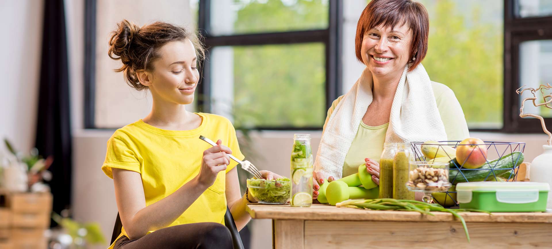 Mother and daughter eating.