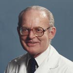 John E. Adams, MD